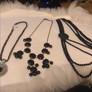 Multiple black strand necklaces